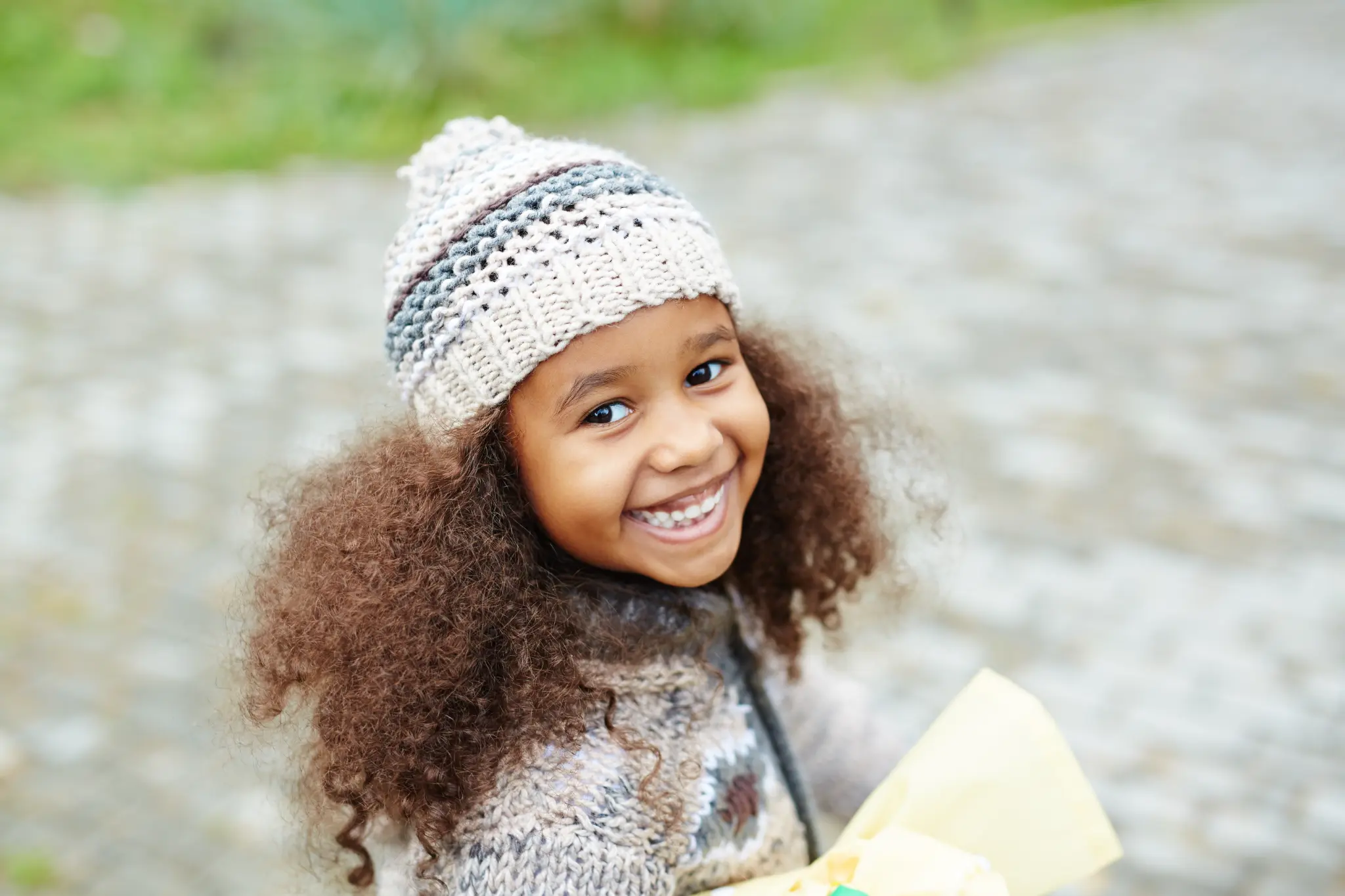 Smiling girl outdoors.